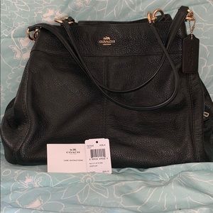 Coach Lexy black pebble leather shoulder bag.